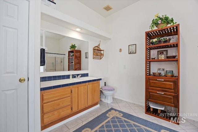 321 S 600 E, Jerome, ID 83338 - full bath featuring vanity, tile patterned floors, a shower stall, toilet, and baseboards