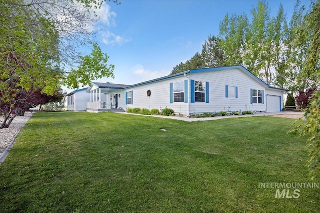 321 S 600 E, Jerome, ID 83338 - view of front of property featuring an attached garage and a front lawn