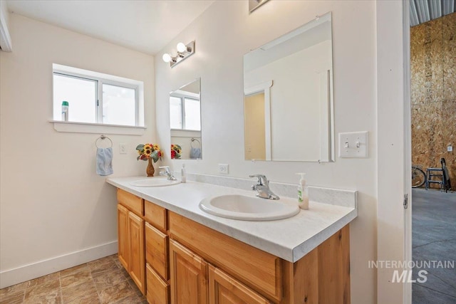 321 S 600 E, Jerome, ID 83338 - bathroom featuring double vanity and baseboards