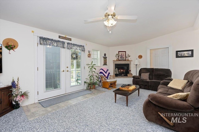 321 S 600 E, Jerome, ID 83338 - carpeted living room featuring french doors, a ceiling fan, and a tiled fireplace
