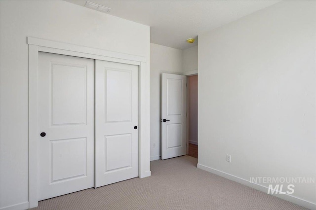6312 W Pewter Point St, Meridian, ID 83646 - unfurnished bedroom with baseboards, visible vents, light carpet, and a closet