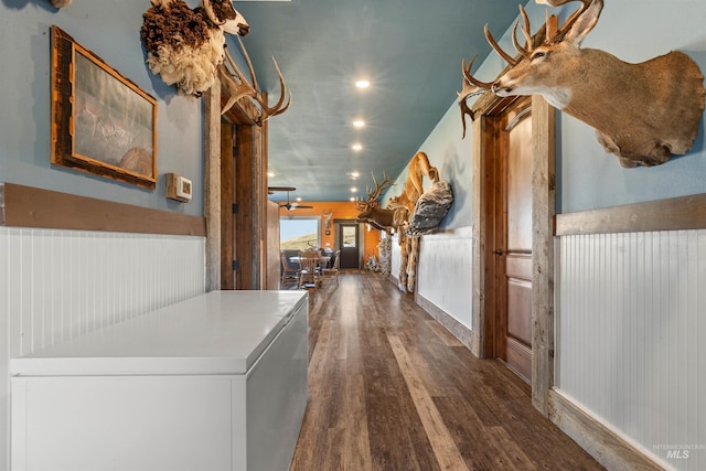 hallway with wainscoting, wood finished floors, and recessed lighting