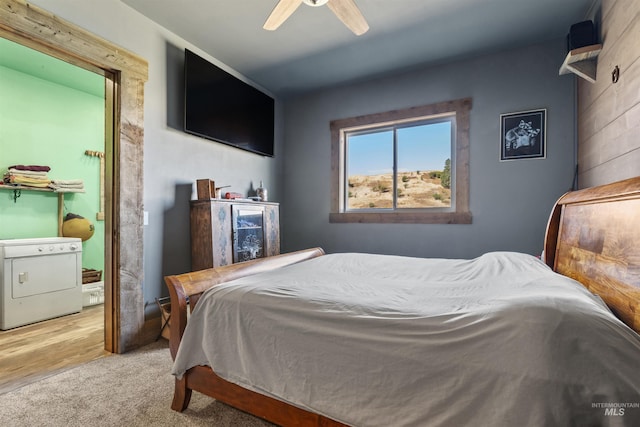 bedroom with washer / dryer and ceiling fan