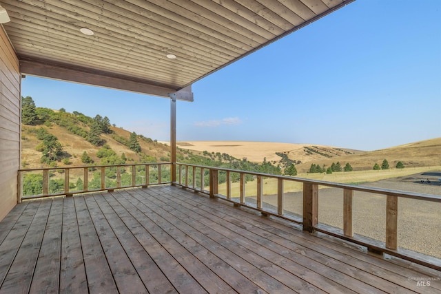 wooden deck featuring a mountain view