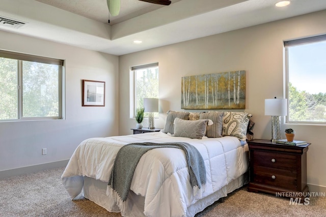 carpeted bedroom featuring visible vents, recessed lighting, and baseboards