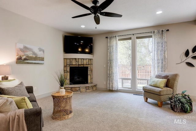 living room featuring recessed lighting, a fireplace, carpet, and ceiling fan