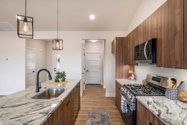 1100 Tanglewood St, Burley, ID 83318 - kitchen featuring modern cabinets, dark wood-style floors, a sink, and stainless steel appliances
