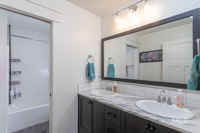 3713 W Ladle Rapids St, Meridian, ID 83646 - full bath featuring a sink, double vanity, and decorative backsplash