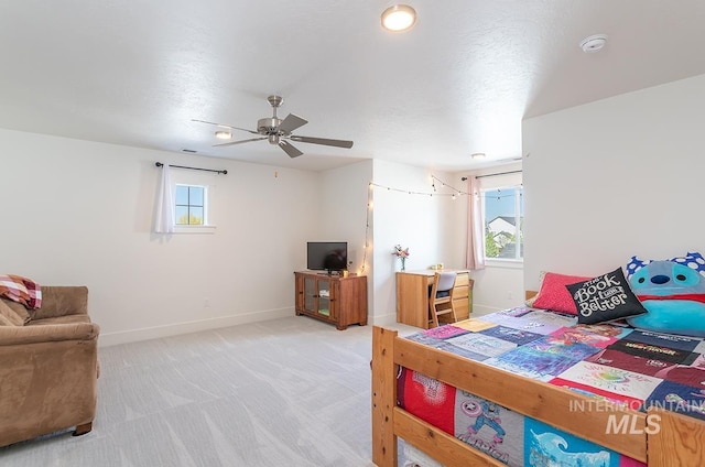 3713 W Ladle Rapids St, Meridian, ID 83646 - bedroom with ceiling fan, light carpet, and baseboards