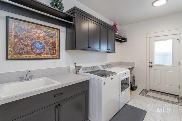 3713 W Ladle Rapids St, Meridian, ID 83646 - clothes washing area featuring a sink, cabinet space, marble finish floor, washer and dryer, and baseboards