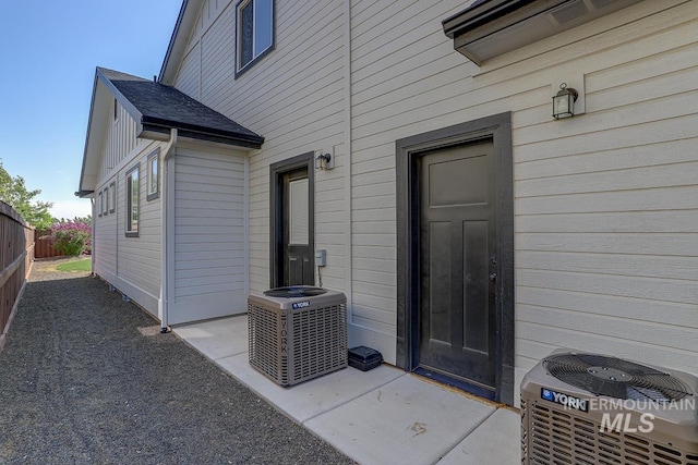 3713 W Ladle Rapids St, Meridian, ID 83646 - entrance to property with central AC unit, fence, and a patio area