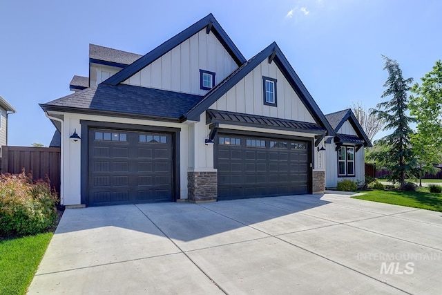 3713 W Ladle Rapids St, Meridian, ID 83646 - modern farmhouse style home featuring driveway, a garage, metal roof, board and batten siding, and a standing seam roof