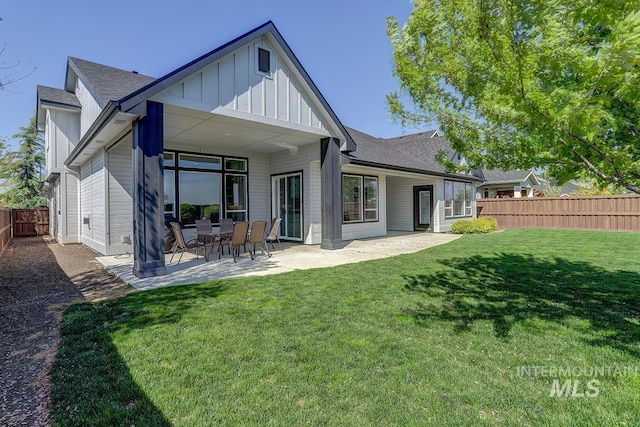 3713 W Ladle Rapids St, Meridian, ID 83646 - back of house featuring a patio, a lawn, a shingled roof, board and batten siding, and a fenced backyard