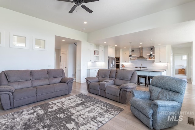3713 W Ladle Rapids St, Meridian, ID 83646 - living room featuring ceiling fan, light wood-type flooring, visible vents, and recessed lighting