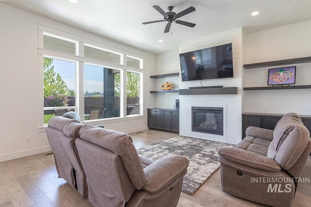 3713 W Ladle Rapids St, Meridian, ID 83646 - living room featuring wood finished floors, a fireplace, baseboards, and recessed lighting