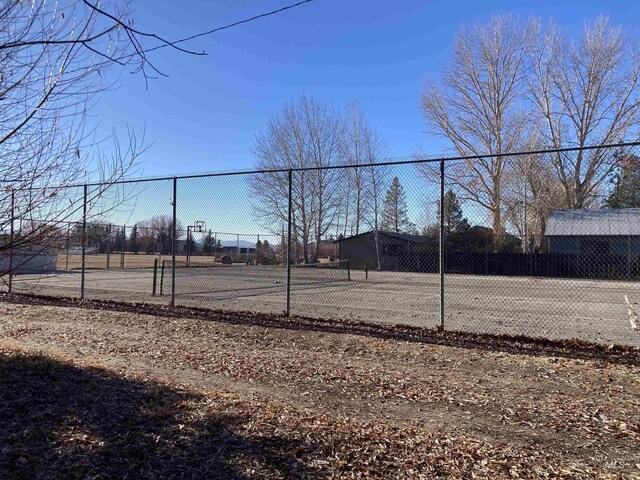 view of yard with tennis court