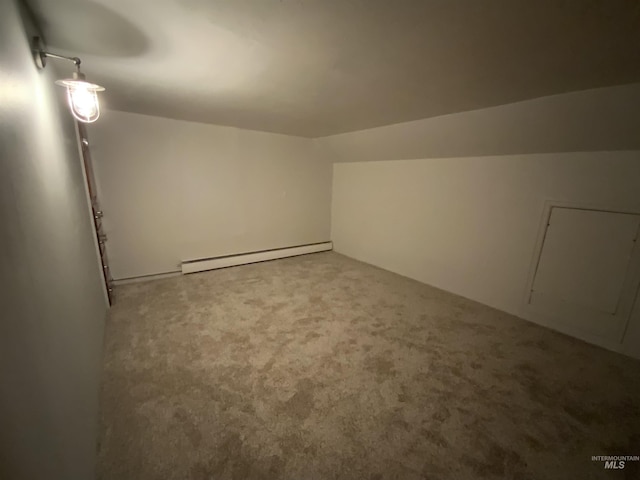 bonus room with carpet flooring, vaulted ceiling, and a baseboard heating unit