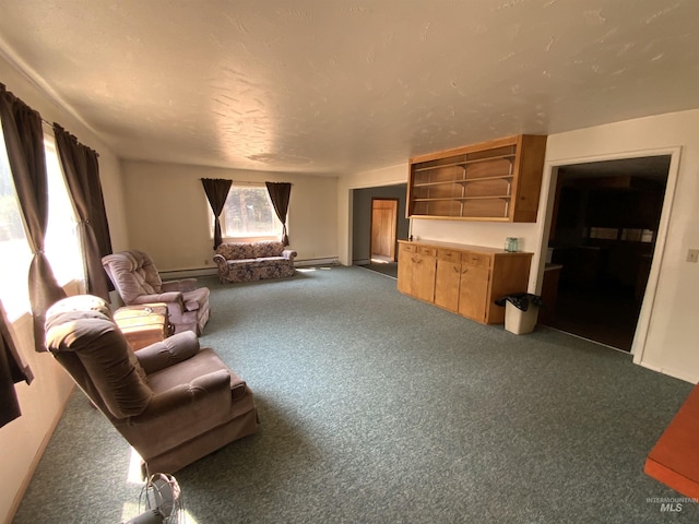 living room with a baseboard radiator and dark carpet