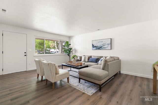 64 Borah, Nampa, ID 83651 - living room featuring dark wood finished floors and baseboards