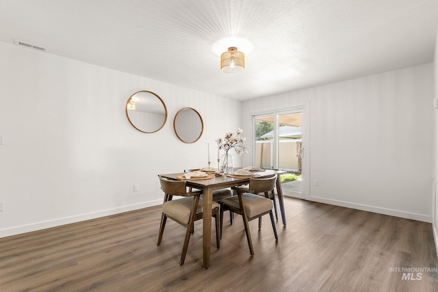 64 Borah, Nampa, ID 83651 - dining area featuring dark wood-style floors and baseboards