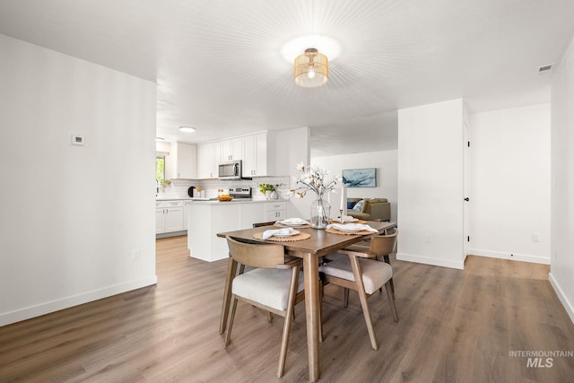64 Borah, Nampa, ID 83651 - dining room with light wood-style flooring and baseboards