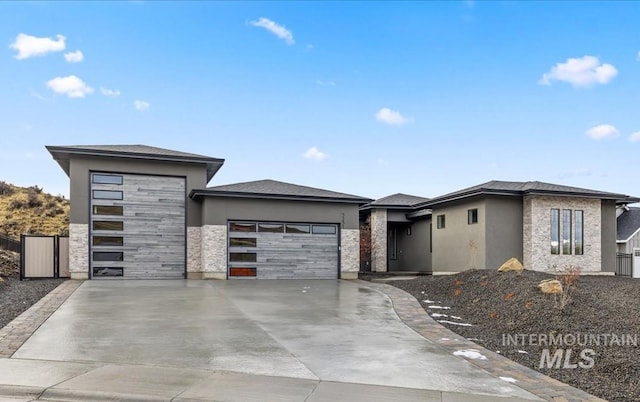 prairie-style house featuring a garage