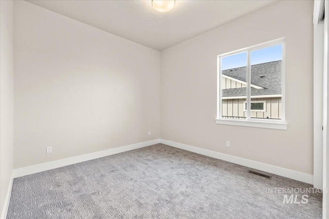 view of carpeted spare room