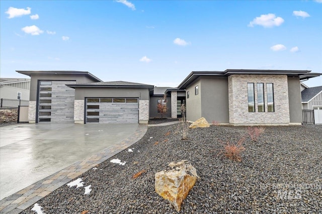 prairie-style home featuring a garage