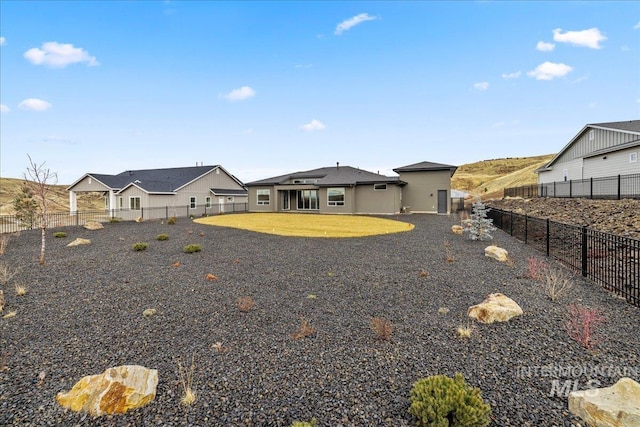 rear view of house with a yard