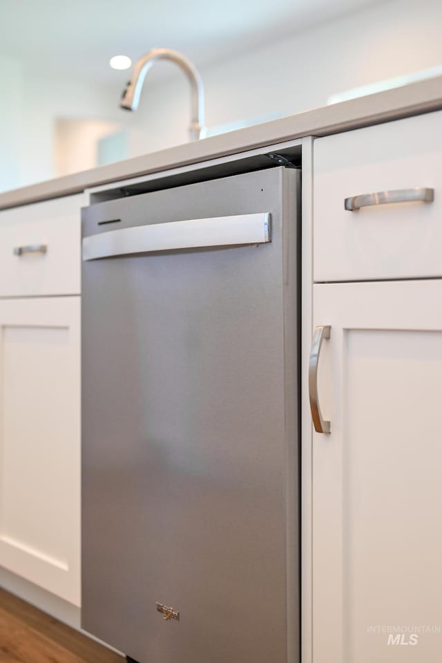 room details with dishwasher and wood-type flooring