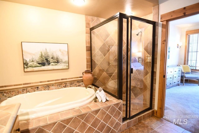 full bathroom with tile patterned floors, a stall shower, and a bath