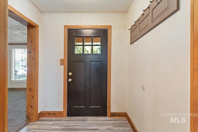 316 Maple Ave, Emmett, ID 83617 - foyer entrance featuring plenty of natural light, light wood finished floors, and baseboards