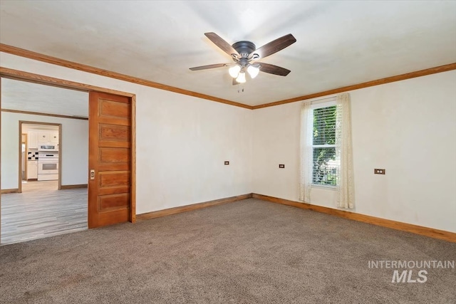 316 Maple Ave, Emmett, ID 83617 - carpeted empty room featuring crown molding, baseboards, and ceiling fan