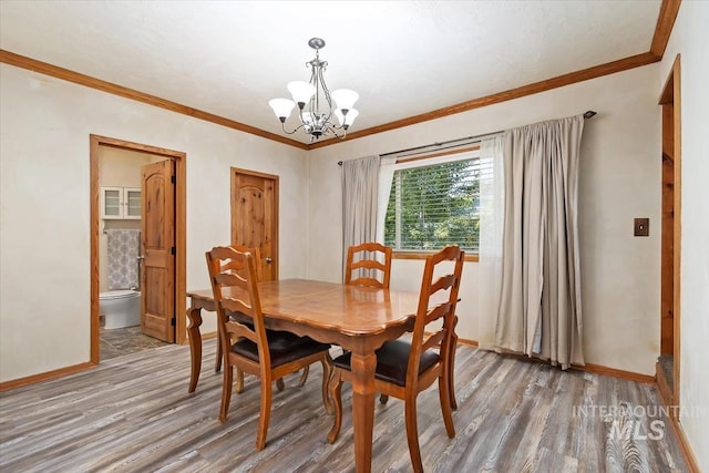 316 Maple Ave, Emmett, ID 83617 - dining space with a chandelier, light wood-type flooring, baseboards, and ornamental molding