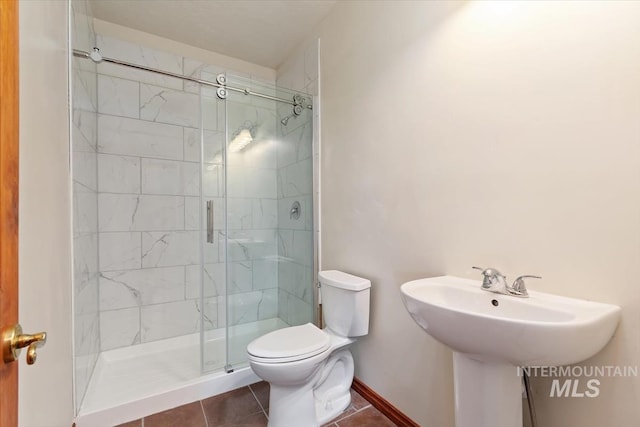 316 Maple Ave, Emmett, ID 83617 - full bathroom featuring tile patterned flooring, a stall shower, toilet, and baseboards