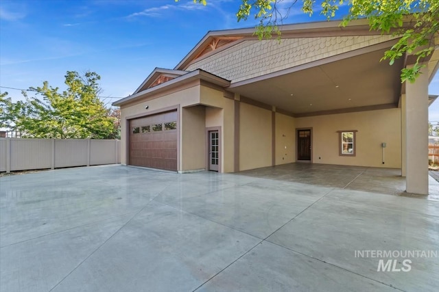 316 Maple Ave, Emmett, ID 83617 - view of front facade featuring stucco siding, a garage, and concrete driveway