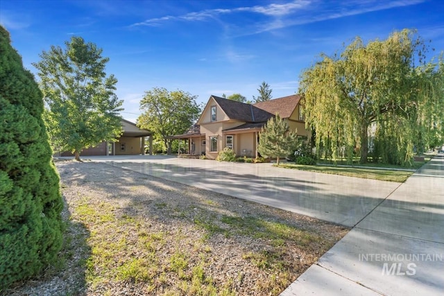 316 Maple Ave, Emmett, ID 83617 - view of front of house featuring concrete driveway and stucco siding