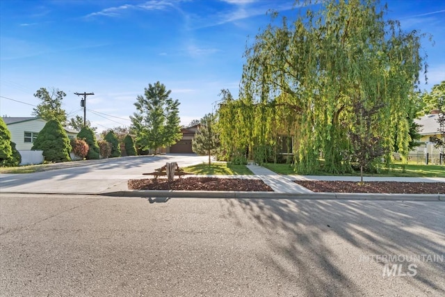 316 Maple Ave, Emmett, ID 83617 - obstructed view of property featuring driveway and a garage