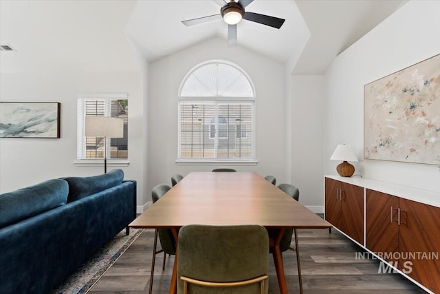 dining area featuring dark wood-type flooring, a wealth of natural light, and ceiling fan