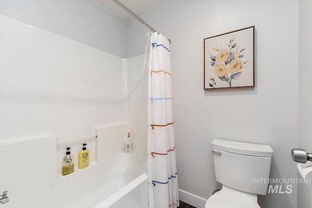 bathroom with toilet and shower / bath combo