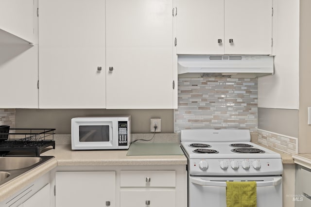 2517/2519 N 21st, Boise, ID 83702 - kitchen with white cabinetry, light countertops, under cabinet range hood, and white appliances