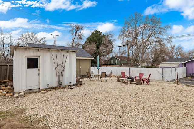 2517/2519 N 21st, Boise, ID 83702 - view of shed featuring a fenced backyard and a fire pit