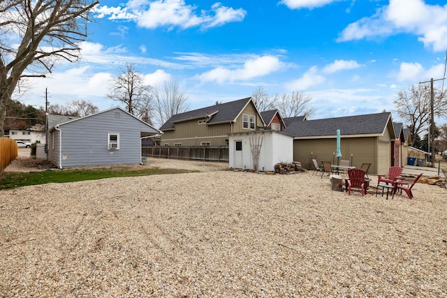 2517/2519 N 21st, Boise, ID 83702 - back of house featuring an outdoor fire pit, an outdoor structure, a shed, and fence