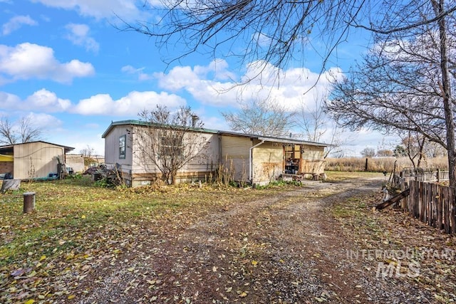 view of property exterior featuring an outbuilding