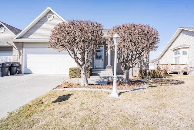 view of front of home with concrete driveway, an attached garage, and brick siding