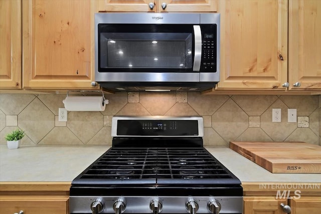 kitchen featuring decorative backsplash and stainless steel appliances