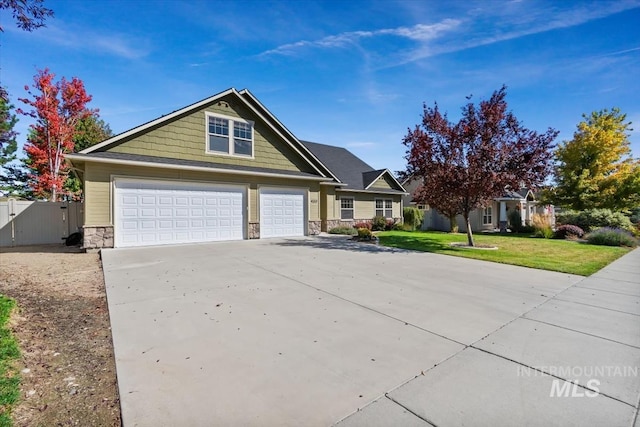 view of front of property with a front lawn and a garage