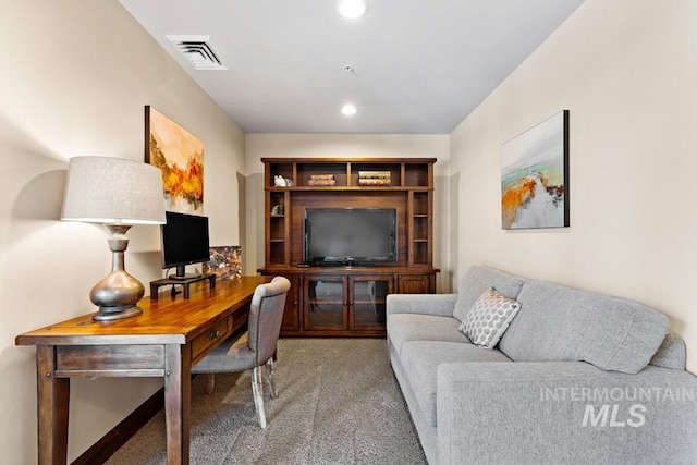 carpeted office with recessed lighting