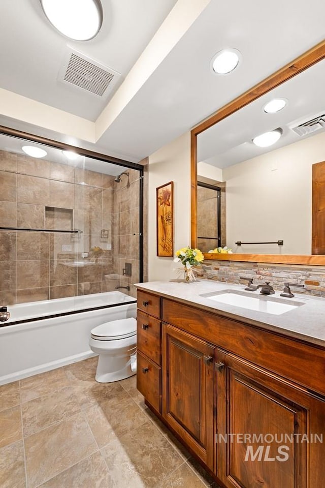 full bath with toilet, shower / bath combination with glass door, vanity, and recessed lighting