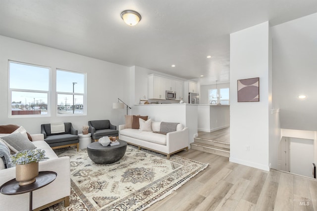 living room with light hardwood / wood-style floors